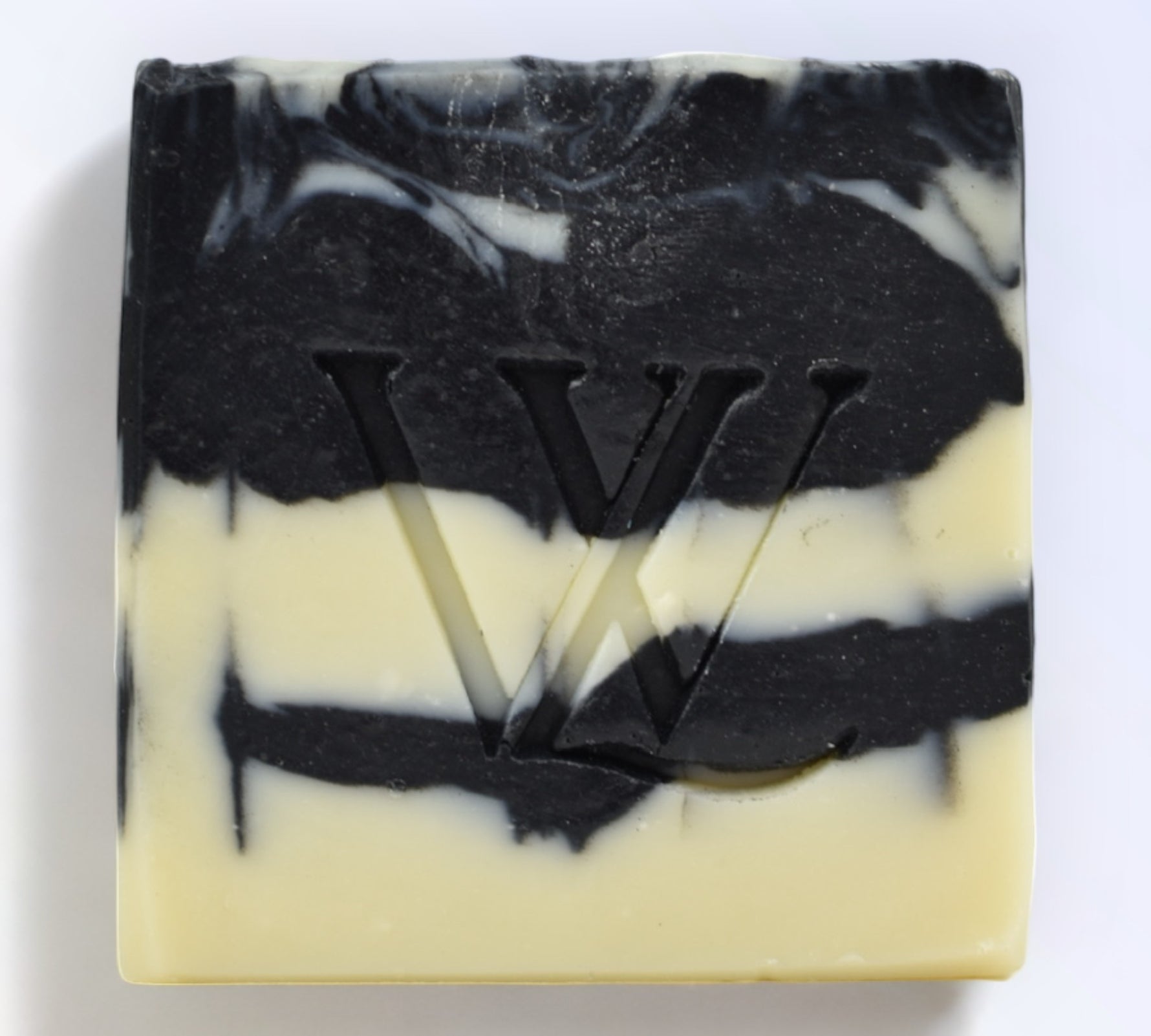 With Love Activated Charcoal Artisan Soap, part of your essential skin care routine, detoxifies and nourishes with activated charcoal, kaolin clay, and essential oils.