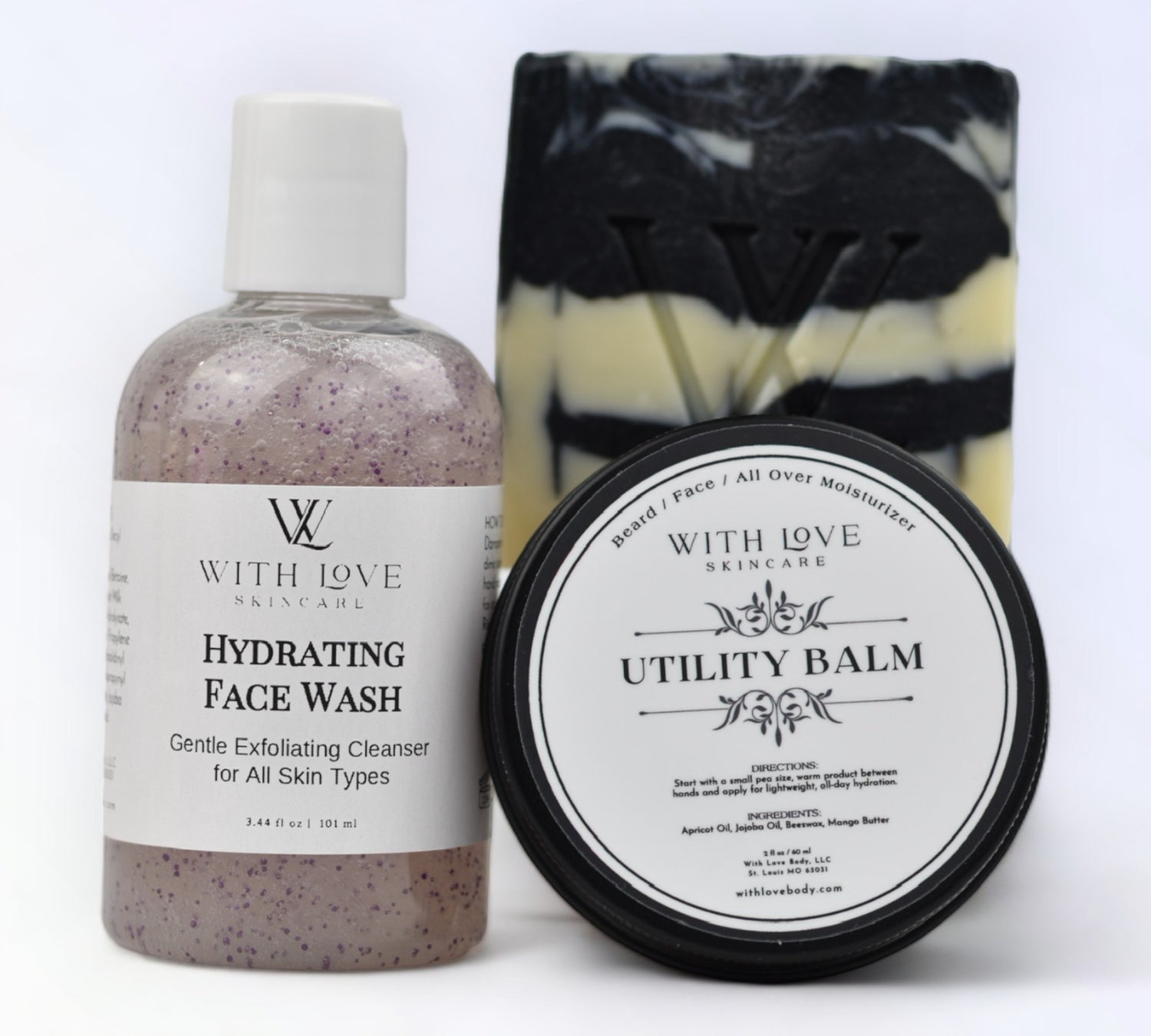 With Love Charcoal Soap, Hydrating Face Wash, and Utility Balm set, part of your essential skin care routine, exfoliating, cleansing, and moisturizing for all skin types.