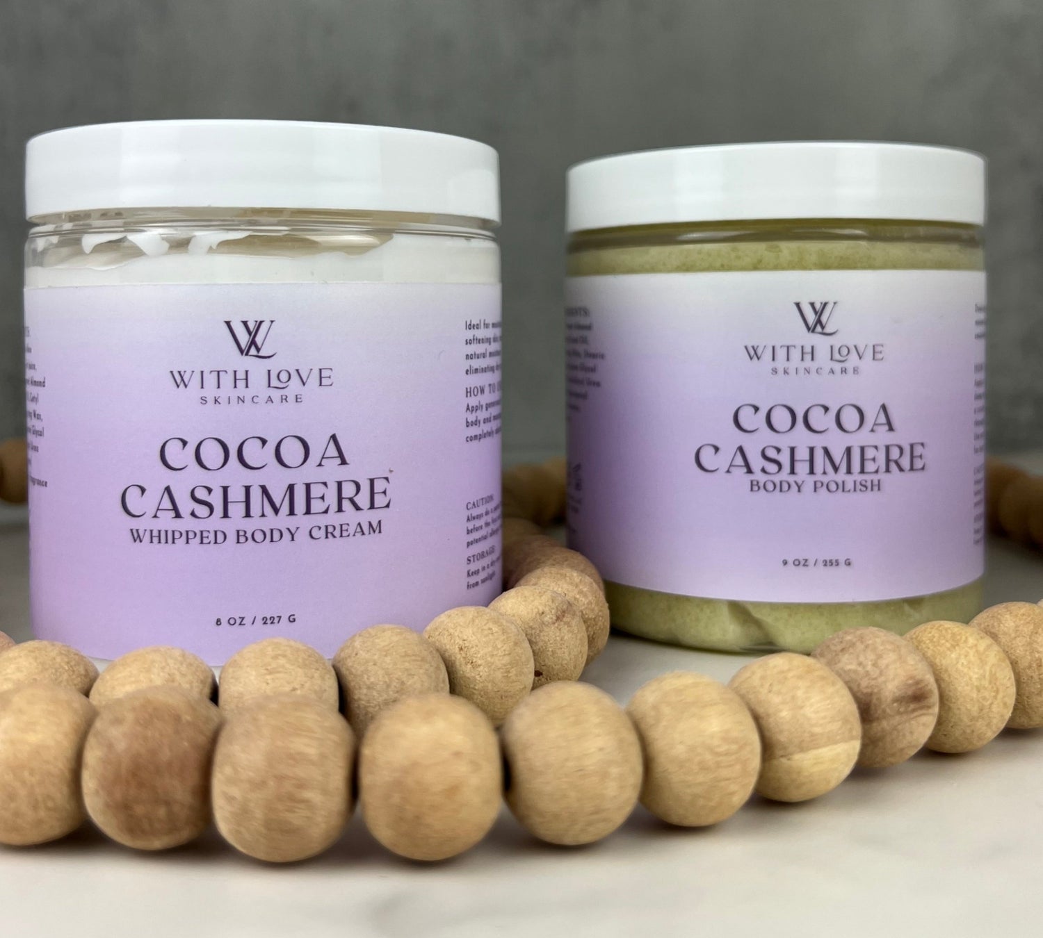 With Love Cocoa Cashmere Set with body cream and body polish, part of your essential skin care routine, with cedarwood, vanilla, and cocoa butter for moisturizing and exfoliating.