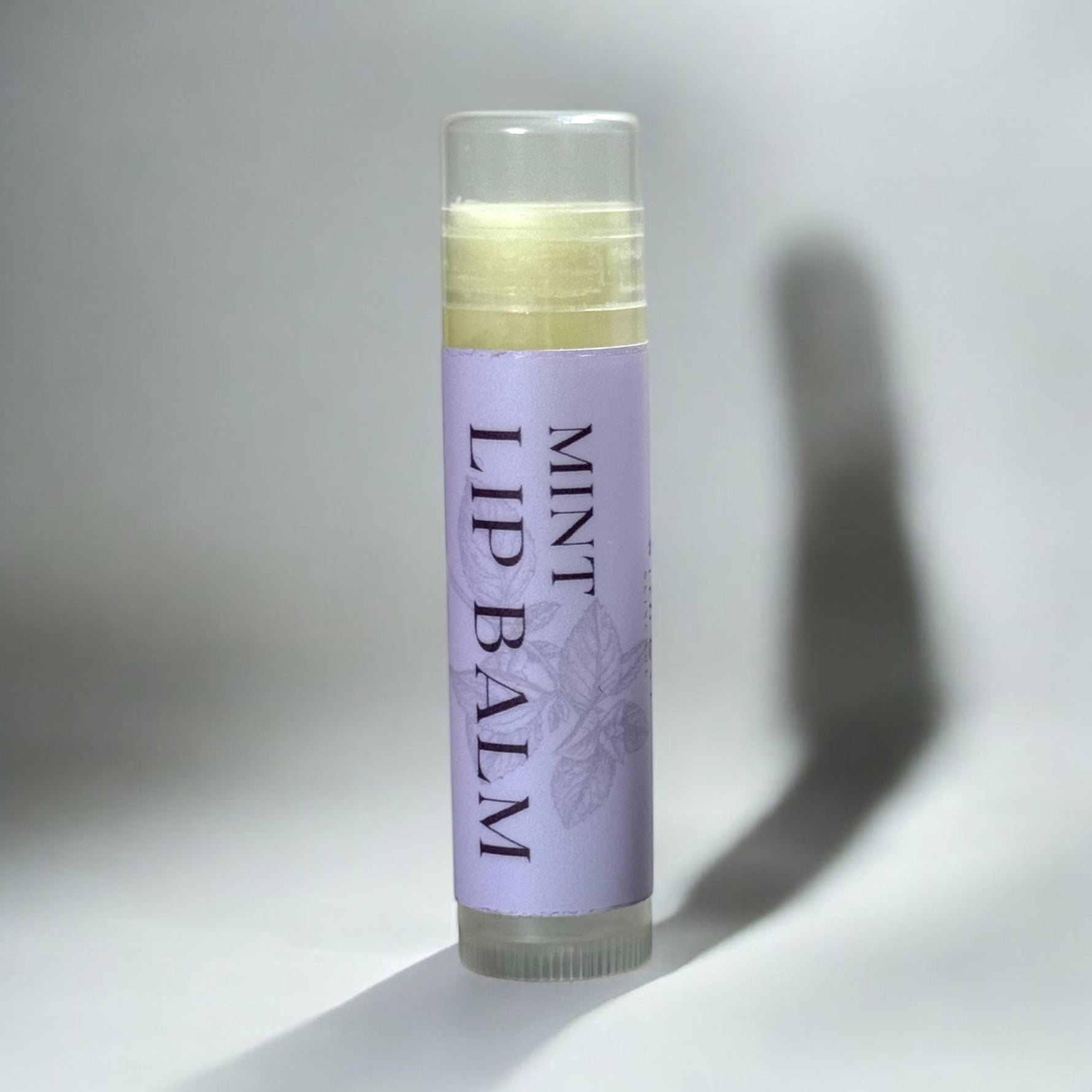 With Love Essential Skin Care Lip Balm with natural formula, mint flavored for soft and nourished lips.