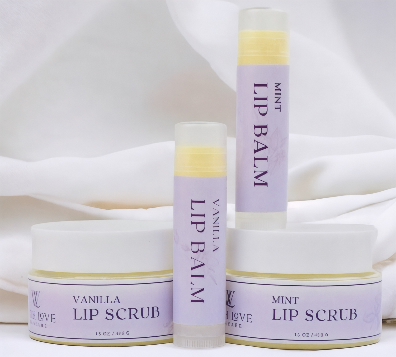 With Love Essential Skin Care Lip Care Duo with exfoliating lip scrub and hydrating lip balm in vanilla or mint for smooth, soft lips.